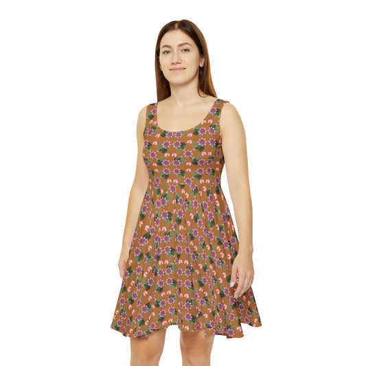 Woman wears the Moni Lee Pink flower summer dress brown