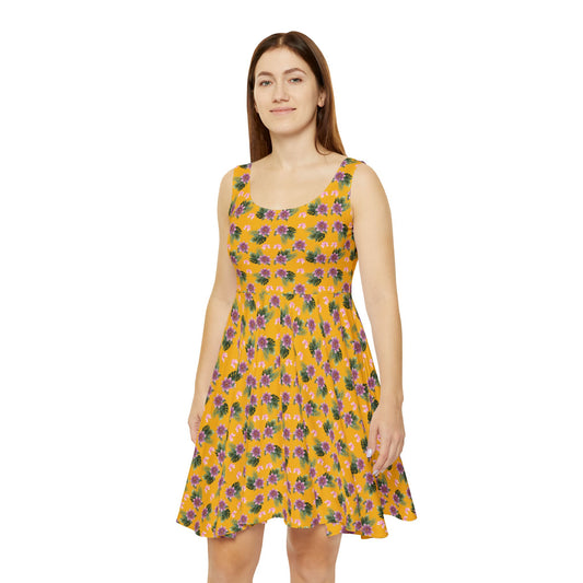 Woman wears the Moni Lee Pink flower summer dress yellow