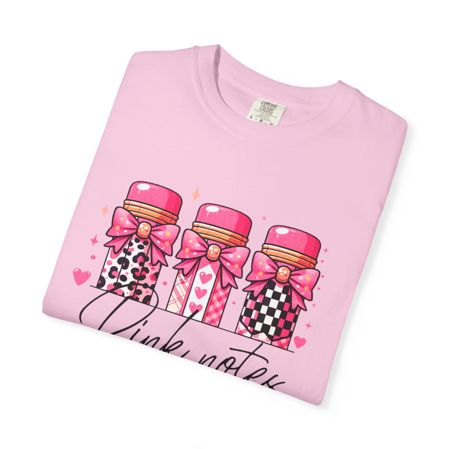 Pink t-shirt with cartoon bottle design and 'Pink Notes' text on a white background