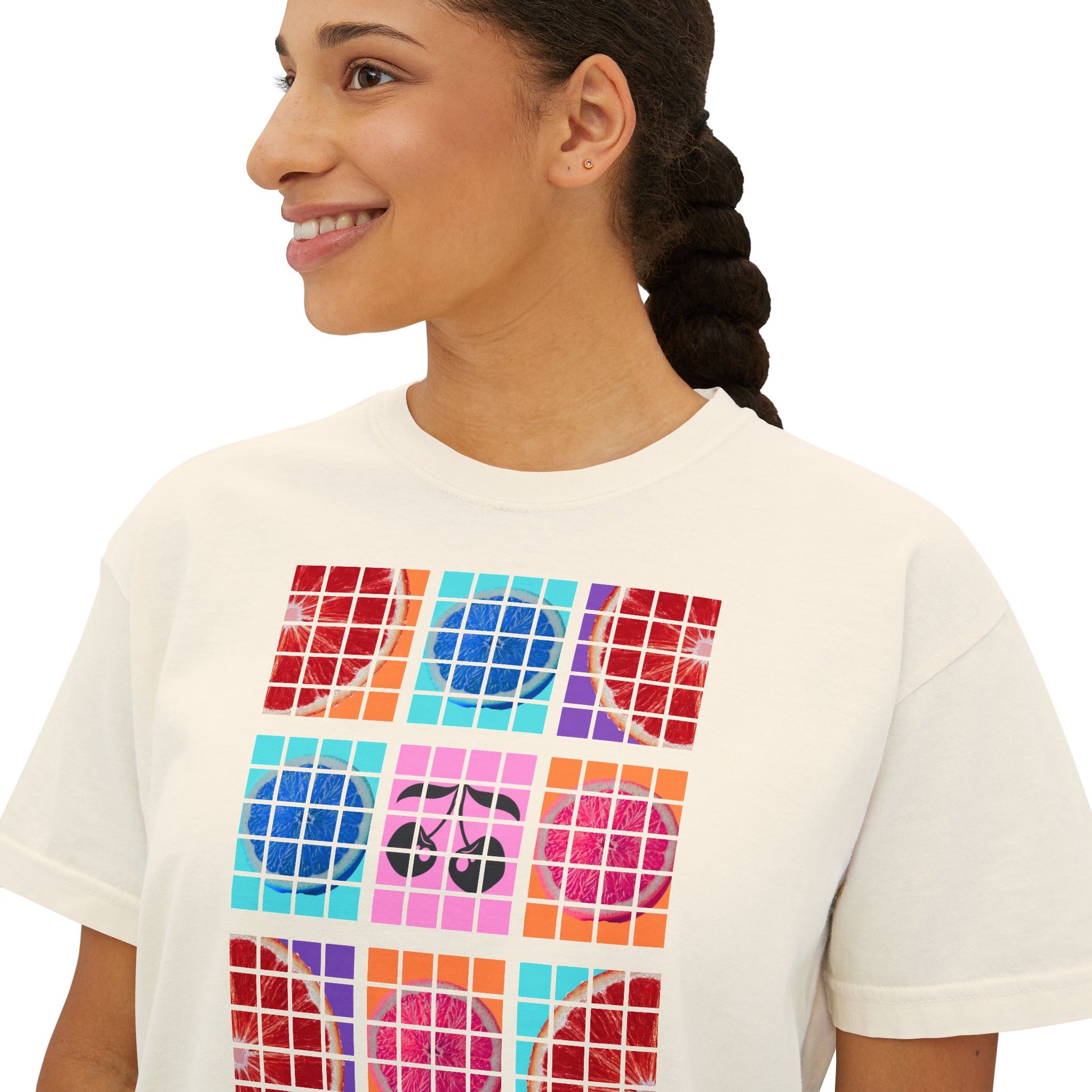 Person wearing a white t-shirt with colorful geometric pattern