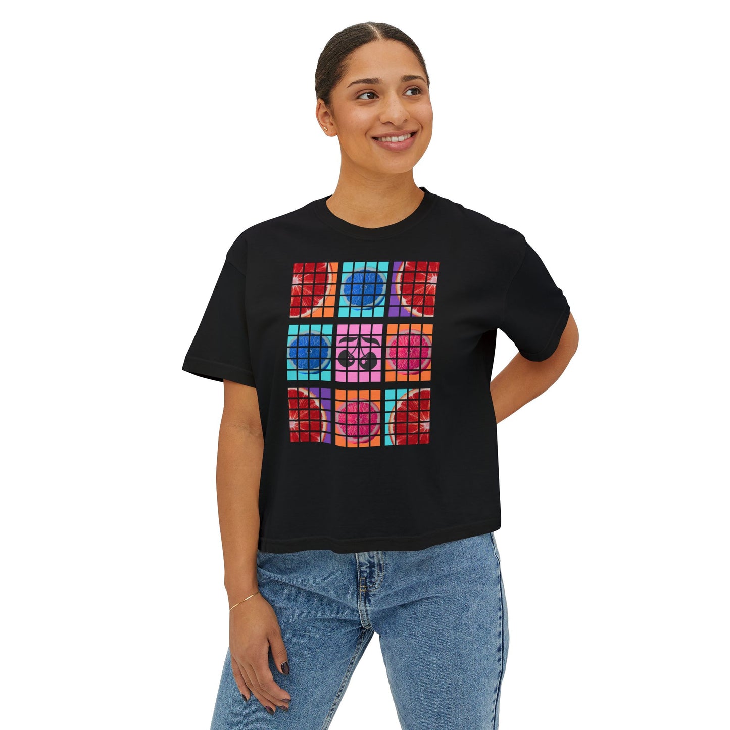 Person wearing a black t-shirt with colorful geometric design on a white background