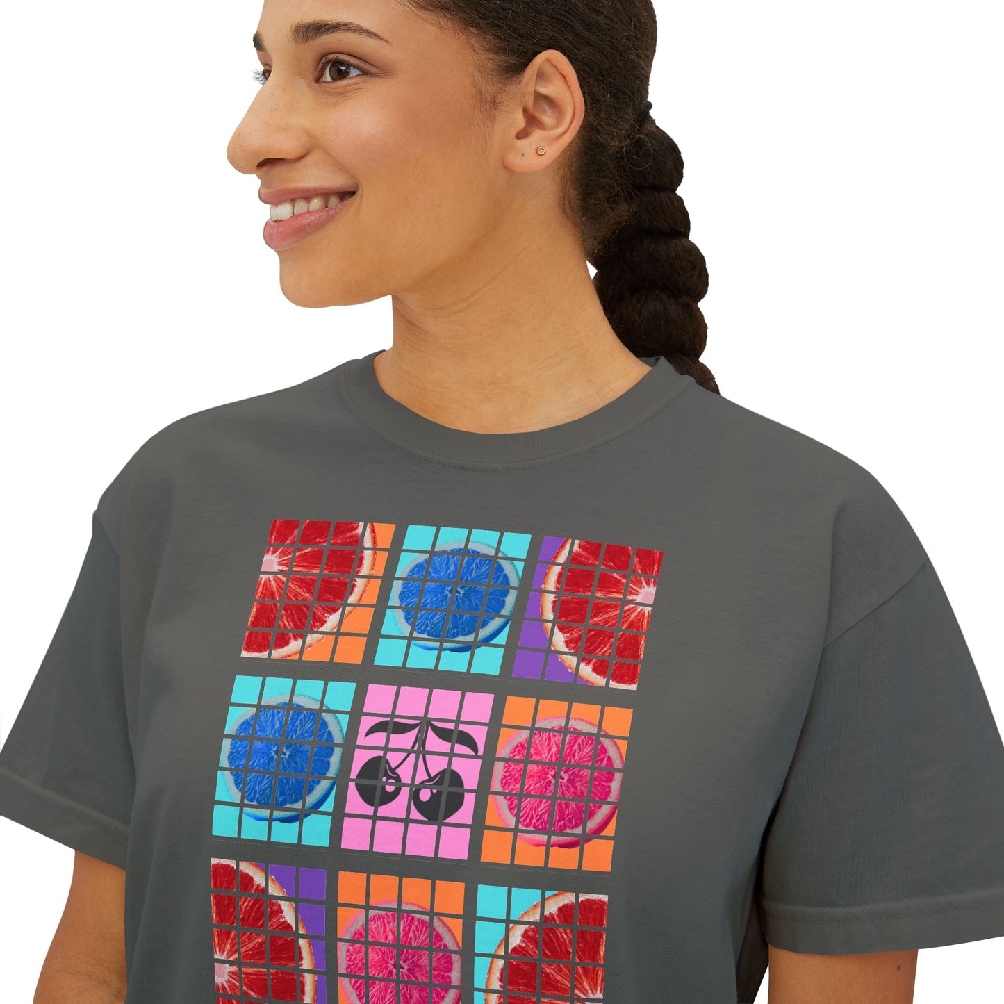Person wearing a gray t-shirt with colorful graphic design on a white background