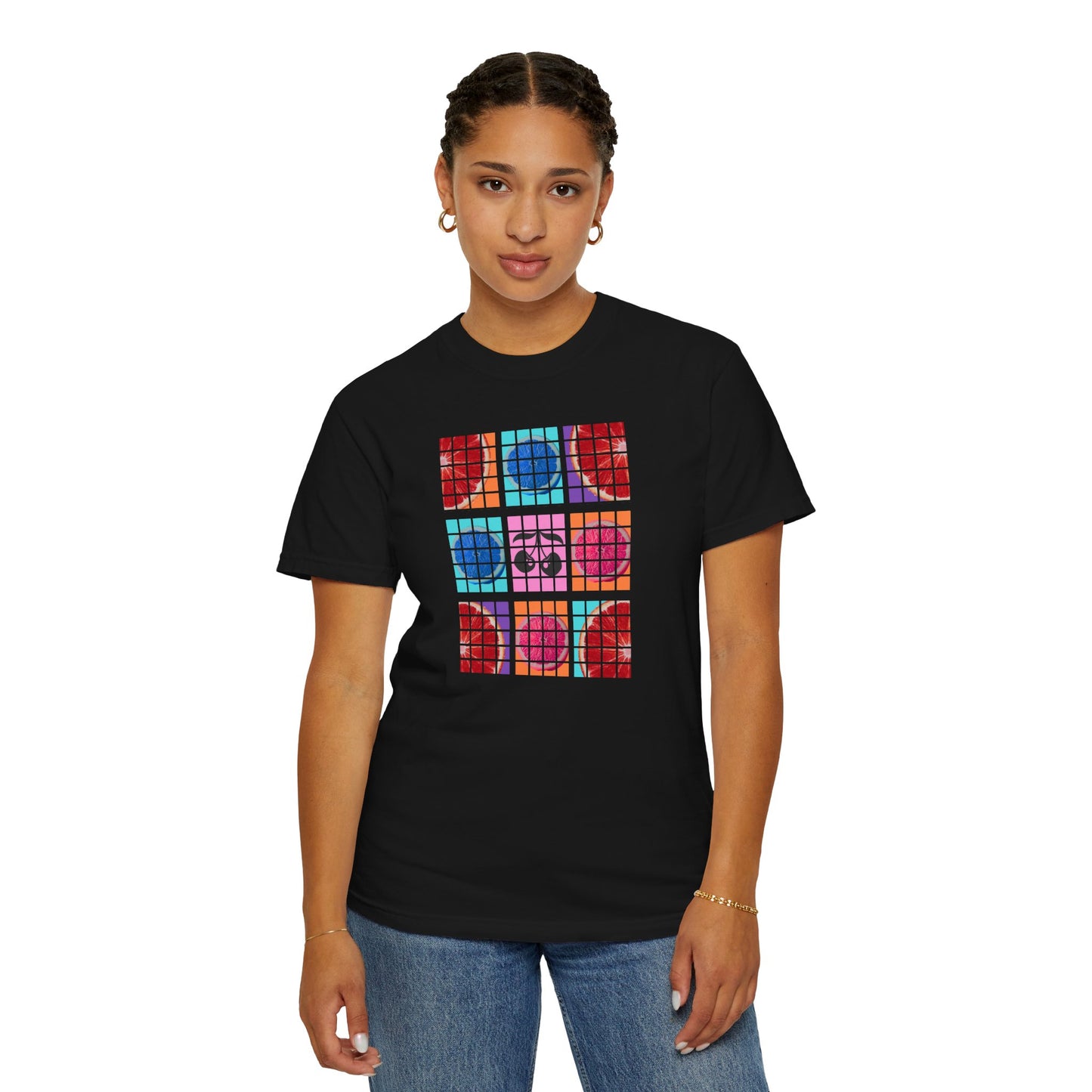Person wearing a black t-shirt with colorful graphic design on a white background