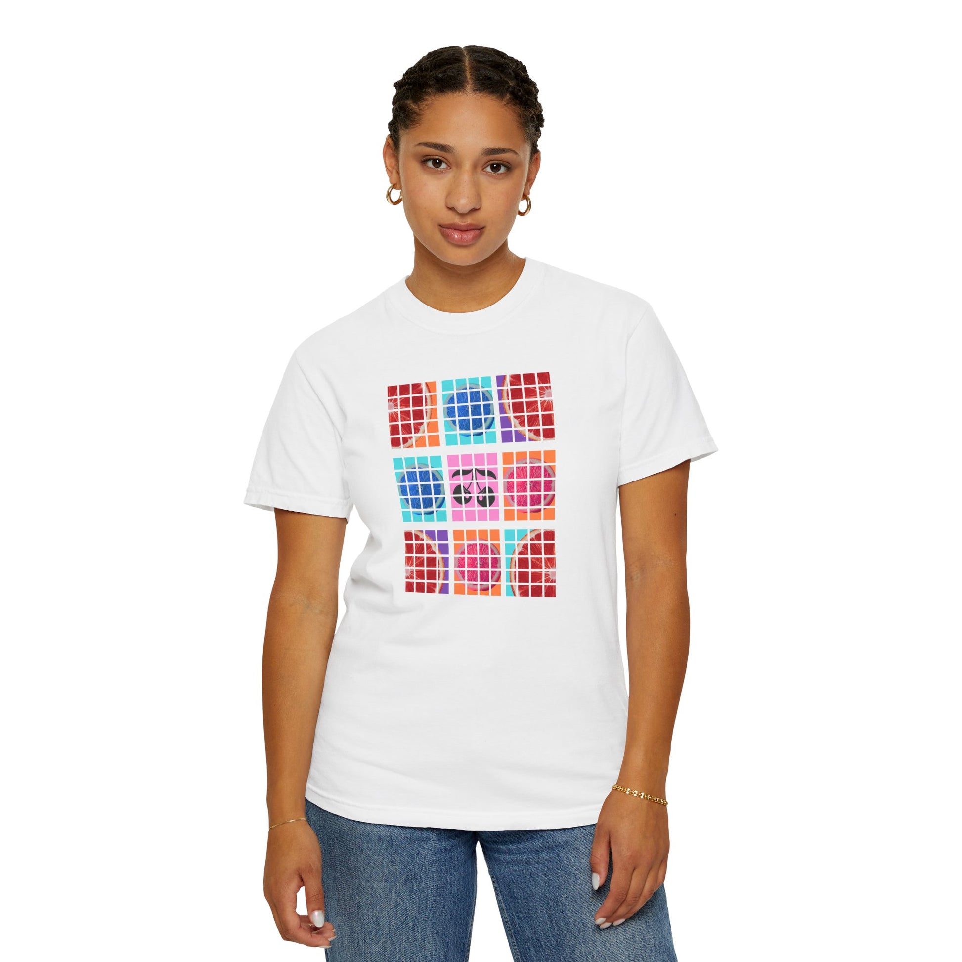 Person wearing a white t-shirt with colorful geometric pattern on a white background