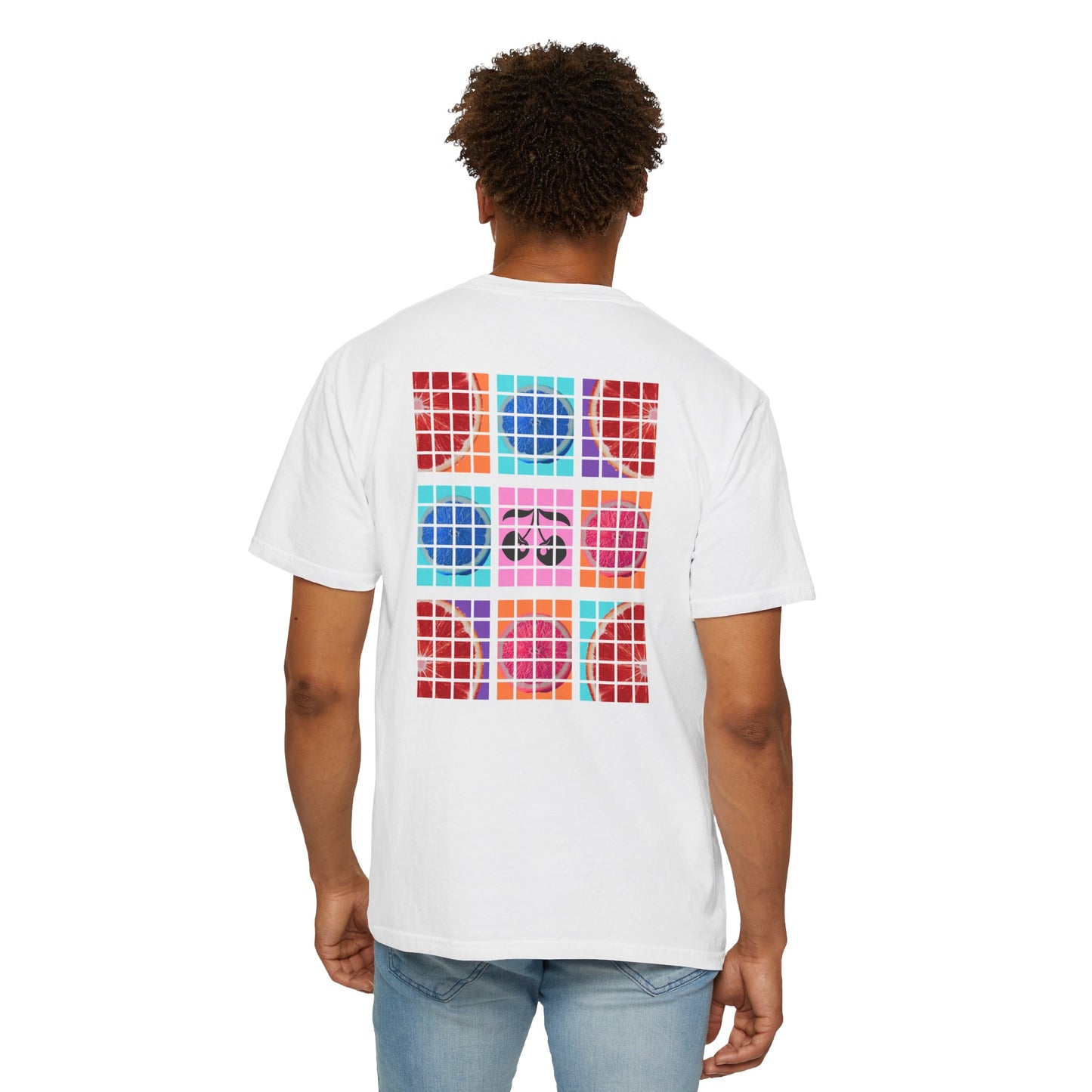 Person wearing a white t-shirt with colorful geometric pattern on the back, standing against a white background.