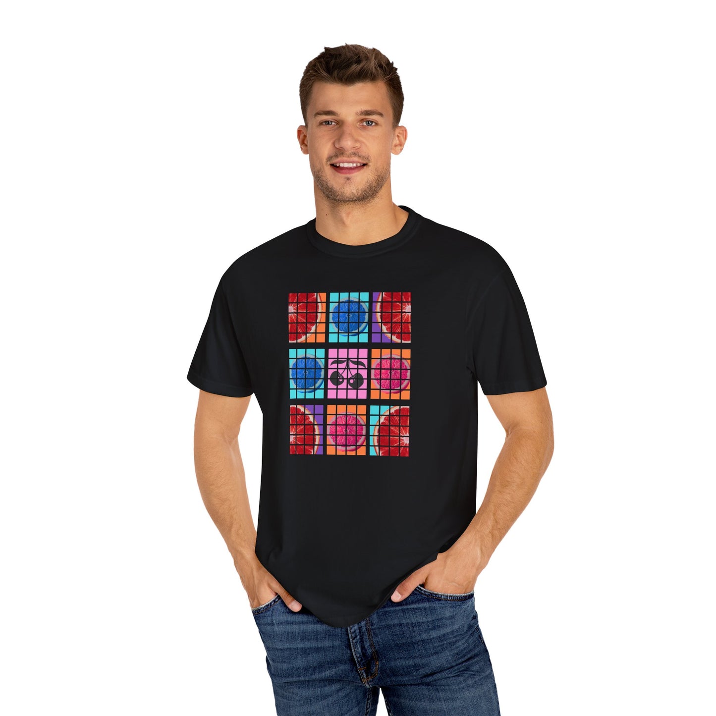 Man wearing a black t-shirt with colorful geometric pattern on a white background