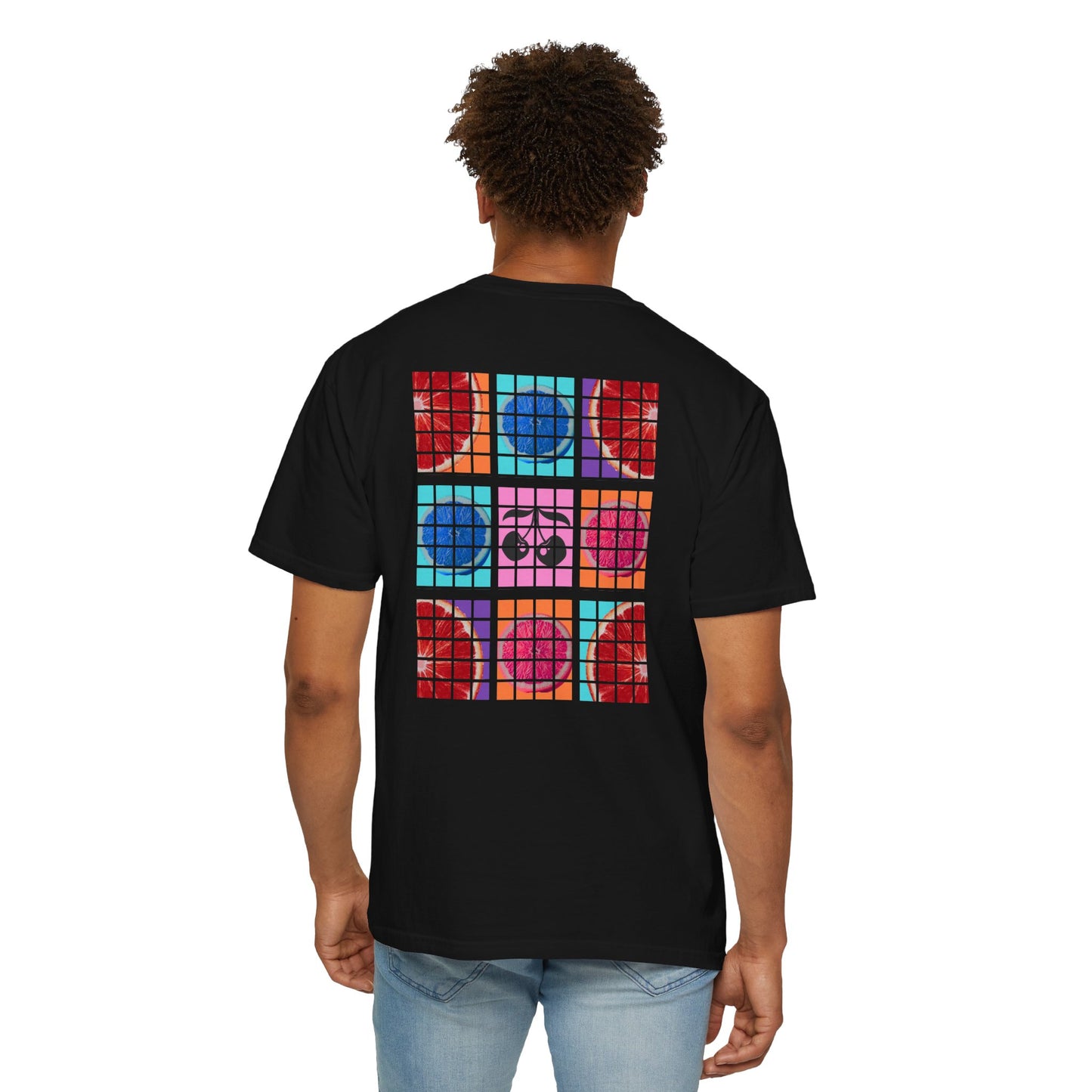 Person wearing a black t-shirt with colorful geometric design on the back