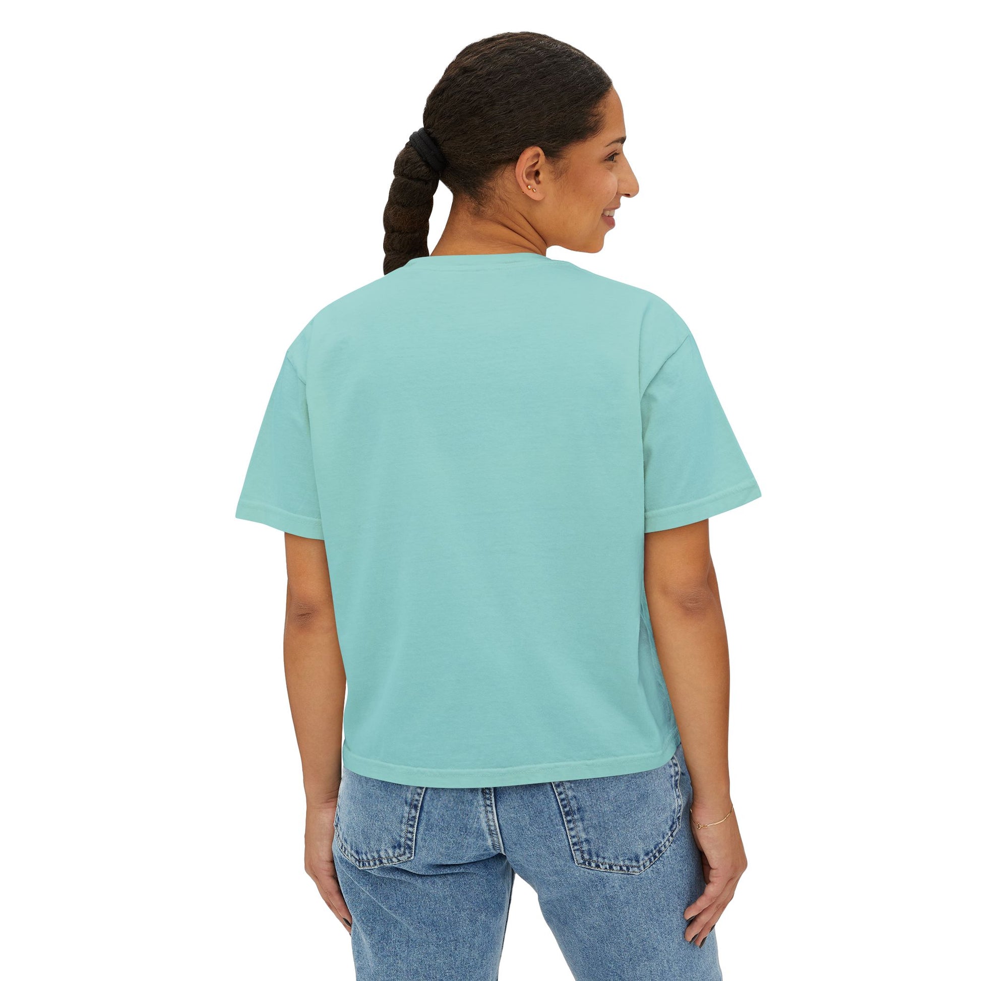 Person wearing a light blue t-shirt and jeans on a white background