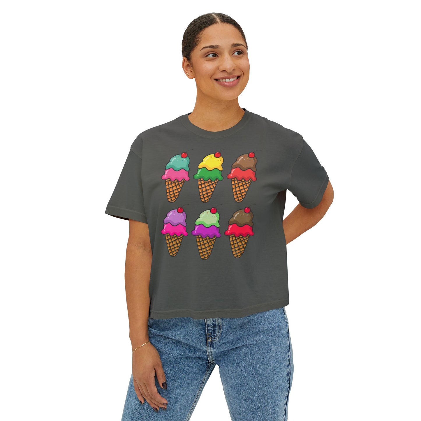 Person wearing a dark gray t-shirt with colorful ice cream cone designs on a white background