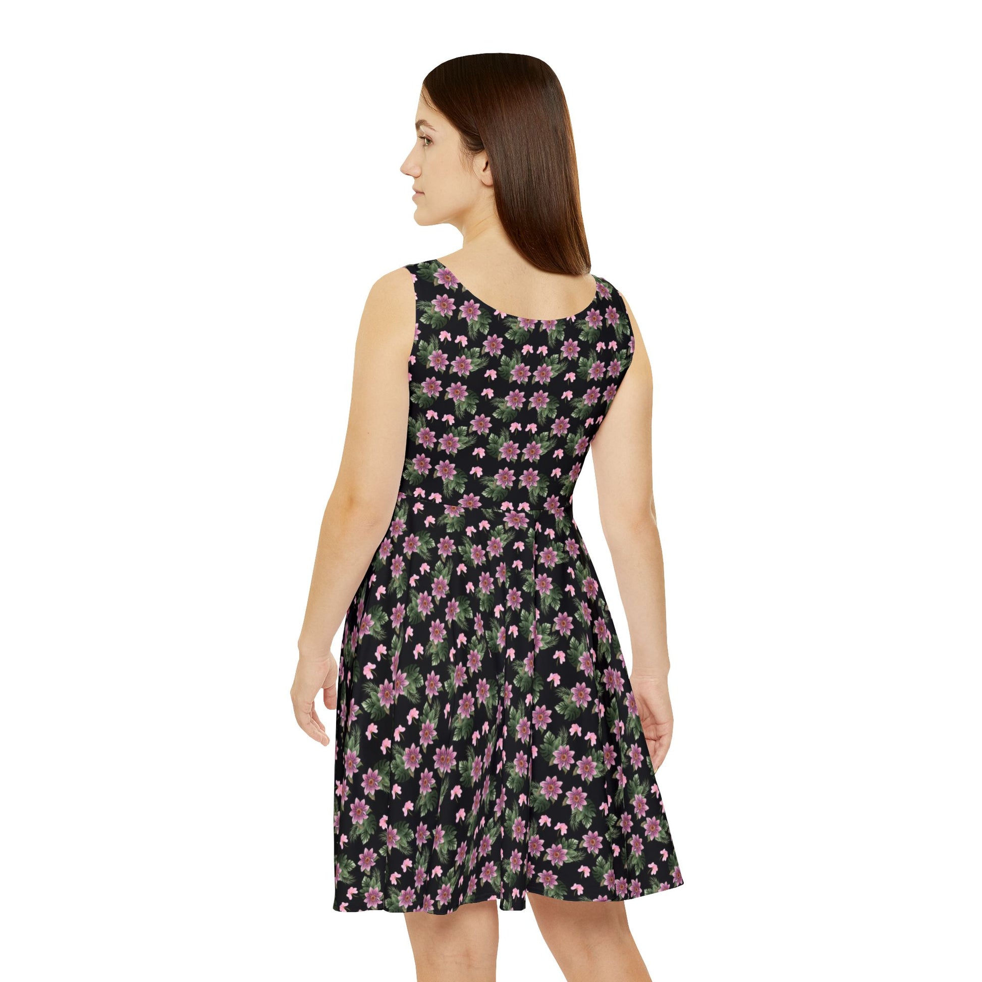 Woman wears the Moni Lee Pink flower summer dress black back