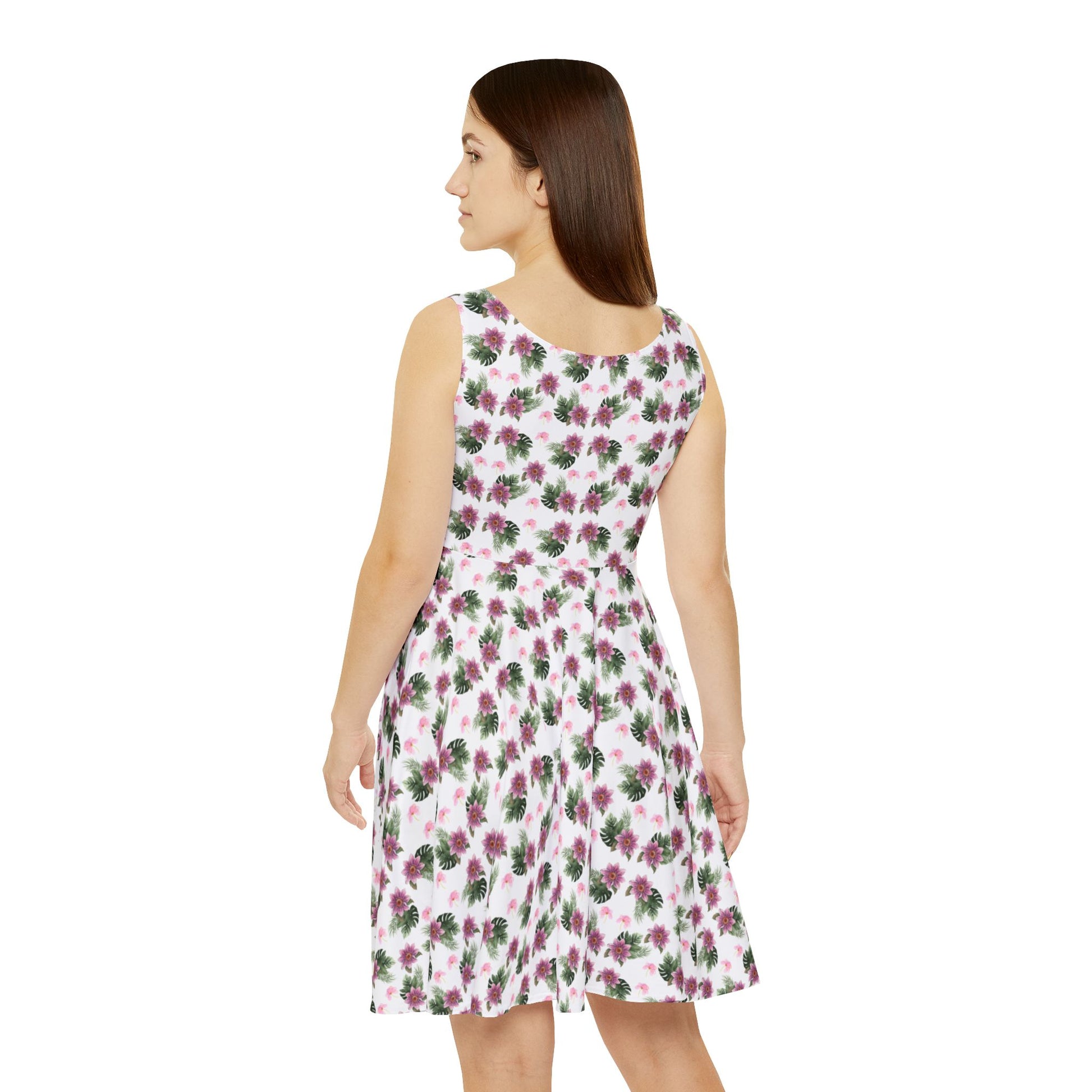 Woman wears the Moni Lee Pink flower summer dress white back