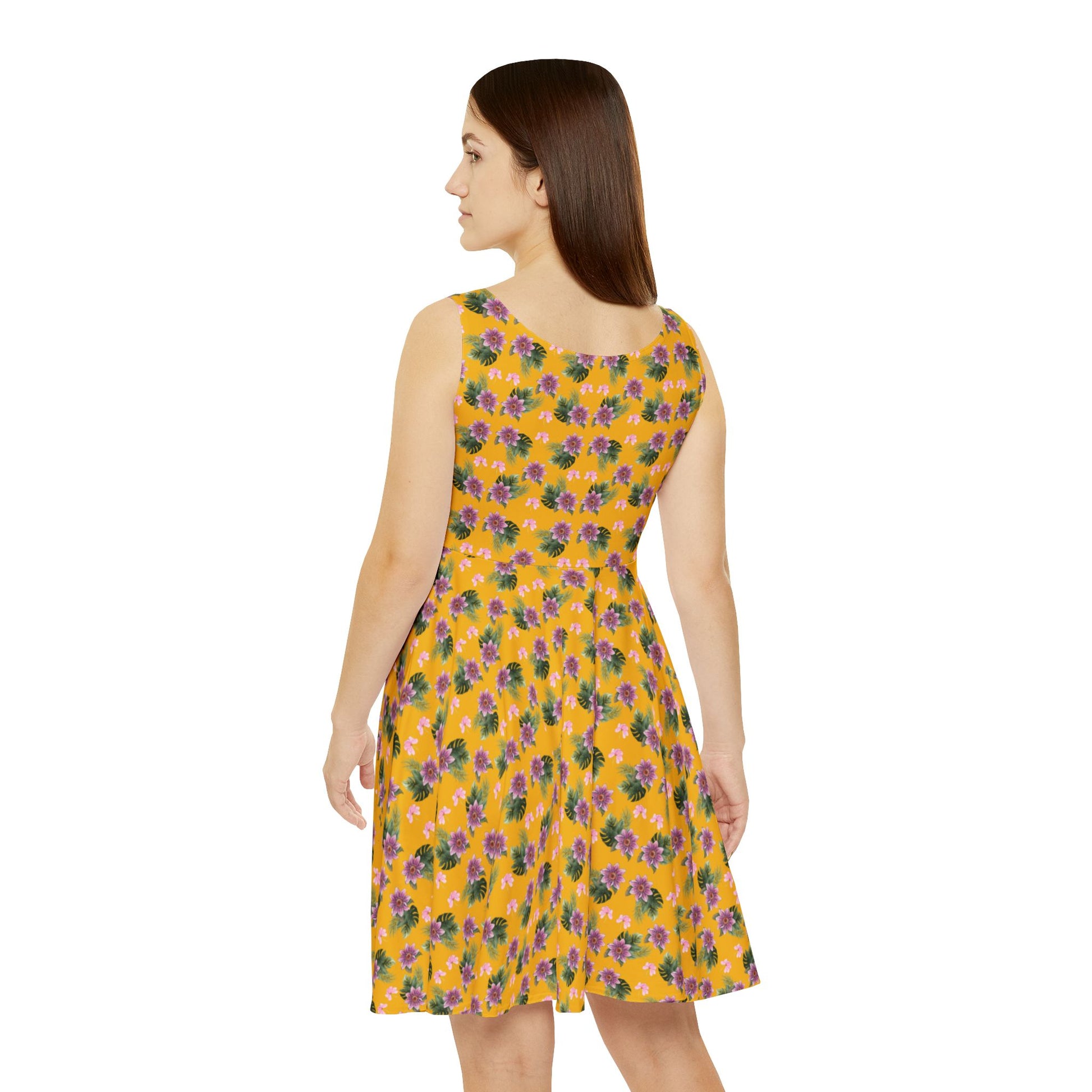 Woman wears the Moni Lee Pink flower summer dress yellow back