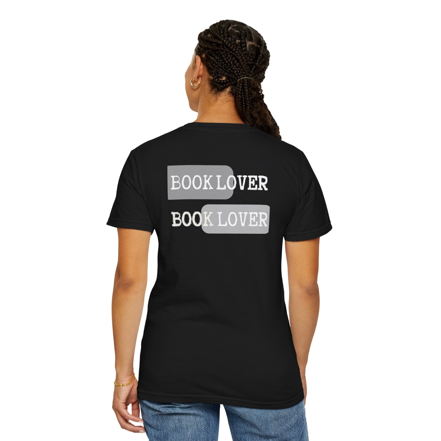 Person wearing a black t-shirt with 'BOOK LOVER' text on the back, standing against a white background.