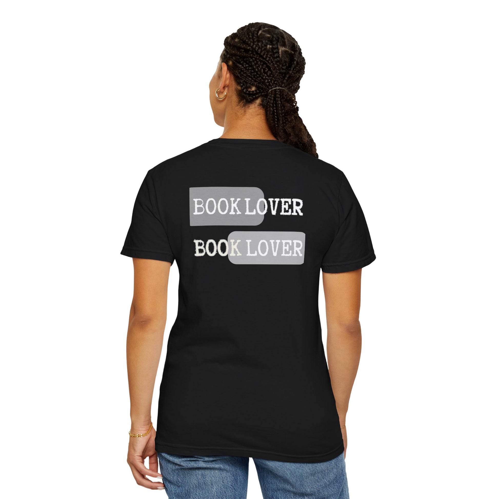 Person wearing a black t-shirt with 'BOOK LOVER' text on the back, standing against a white background.