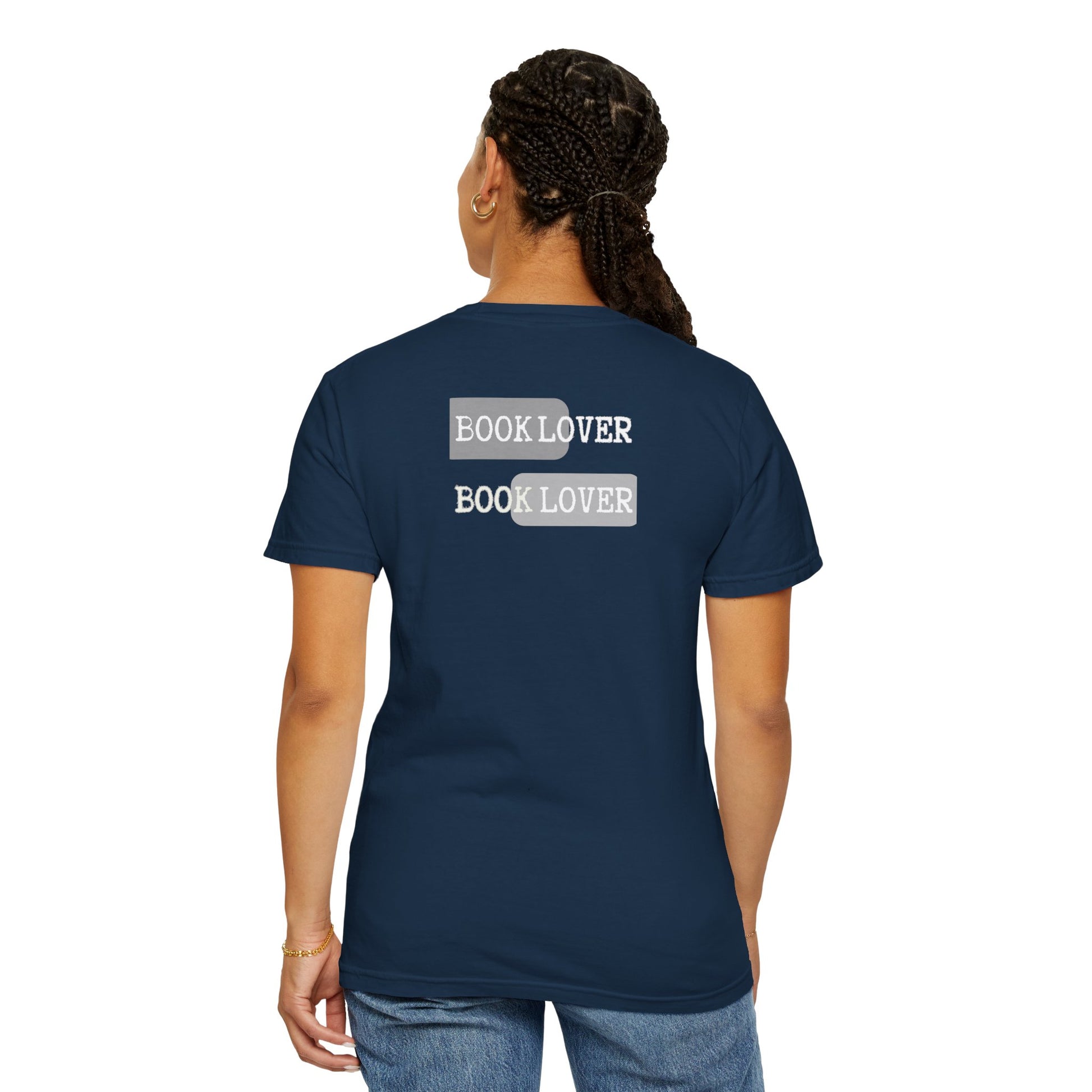 Person wearing a navy blue t-shirt with 'BOOK LOVER' text on the back, on a white background
