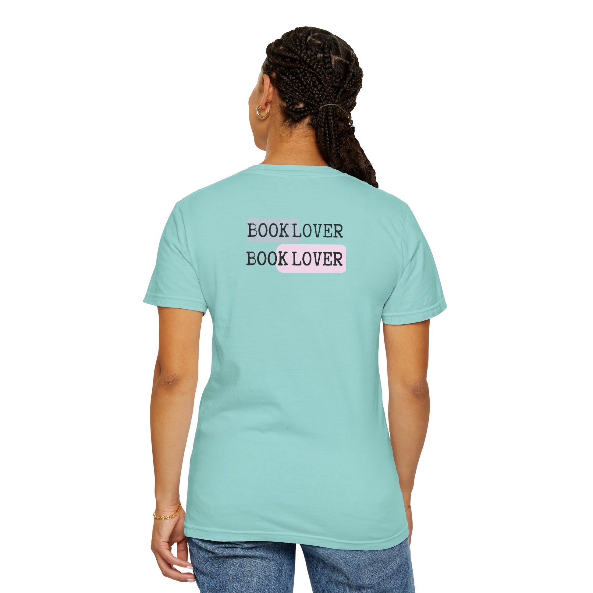 Person wearing a light blue t-shirt with 'BOOK LOVER' text on the back, standing against a white background.