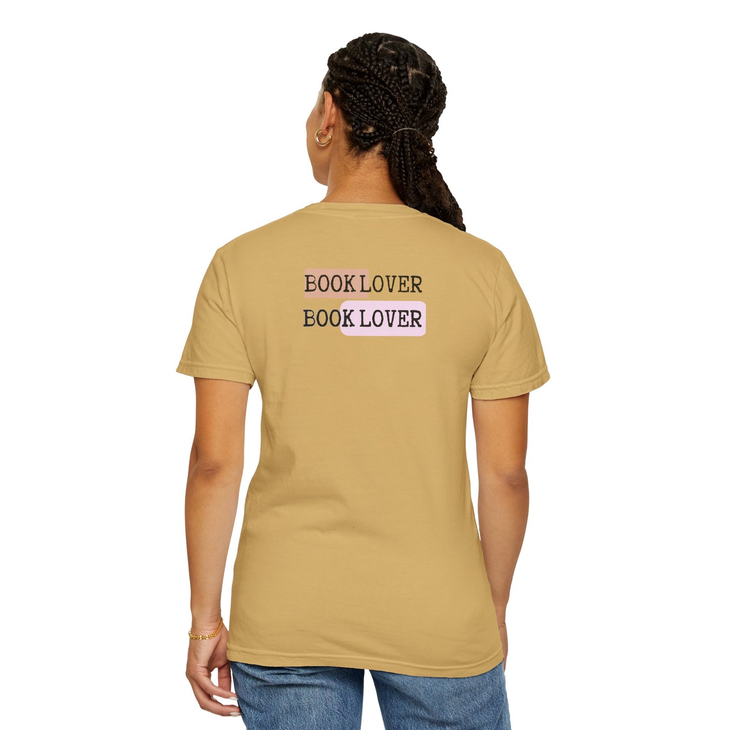 Person wearing a beige t-shirt with 'BOOK LOVER' text on the back, standing against a white background.