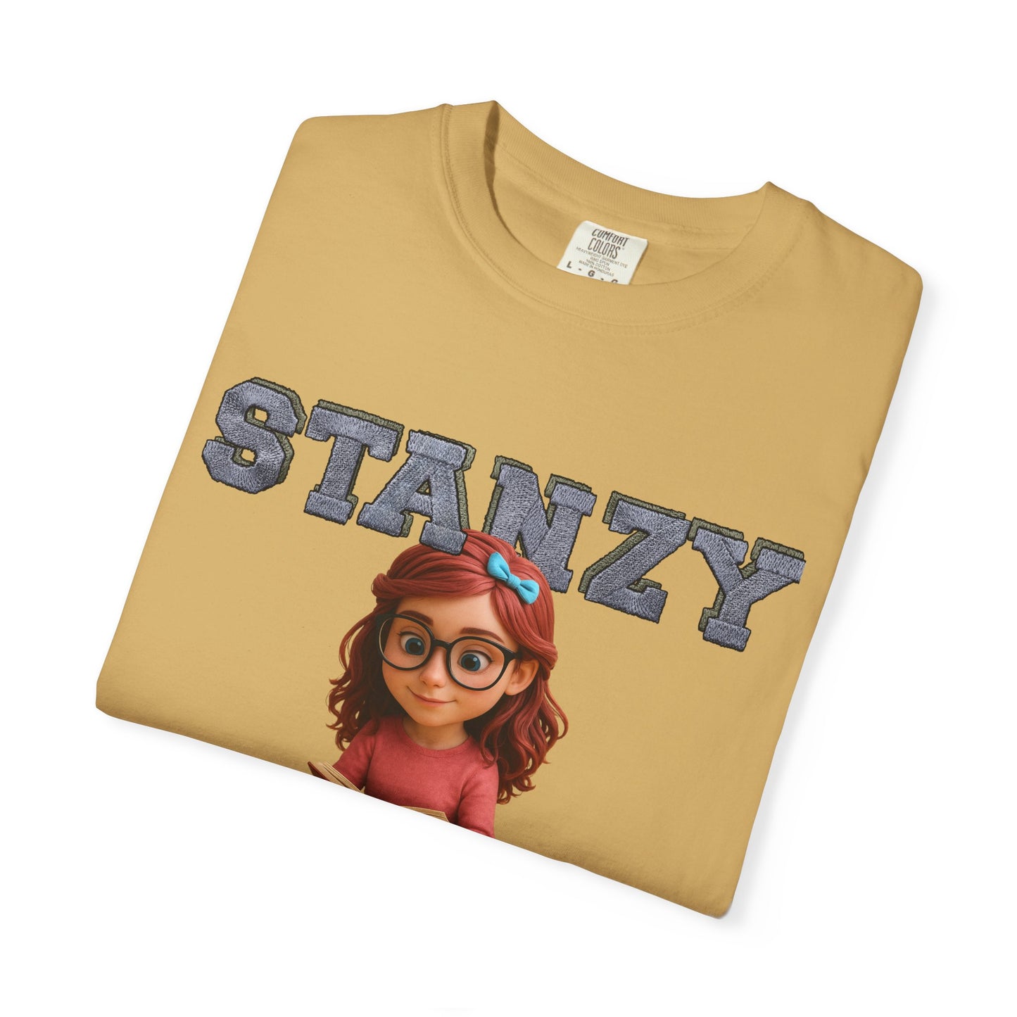 Folded tan t-shirt with 'STANZY' and cartoon character on a white background