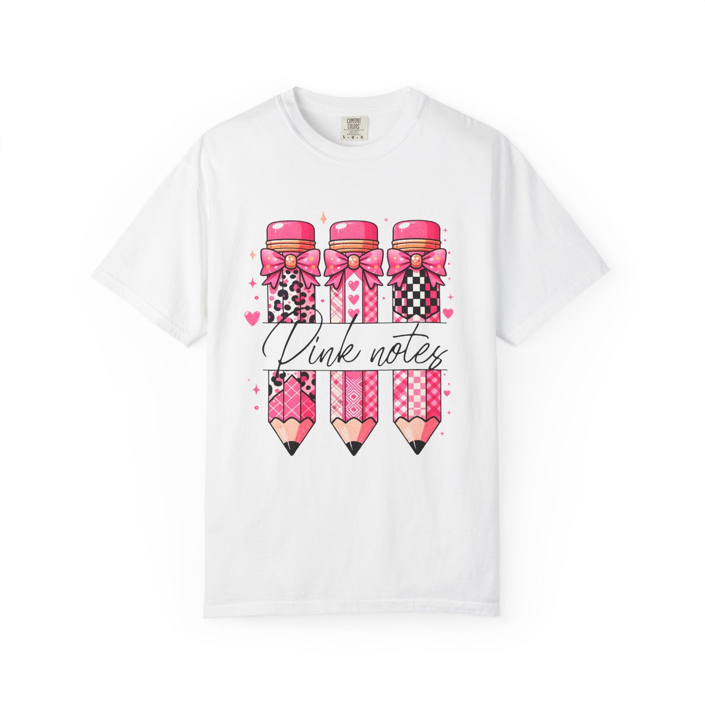 White t-shirt with pink pencils and bows design on a white background